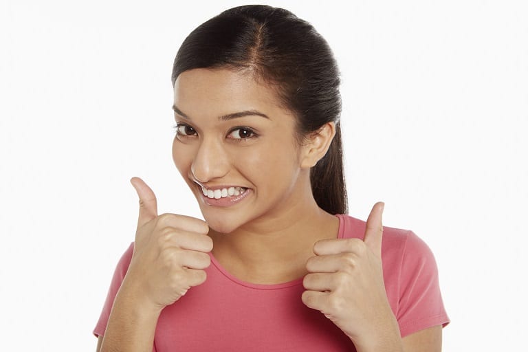 Woman giving two thumbs up