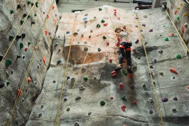 woman rockclimbing