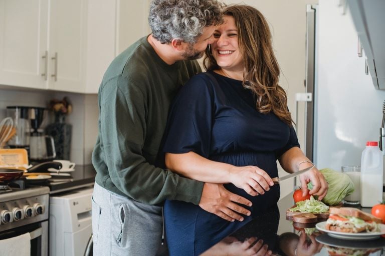 happy couple cooking